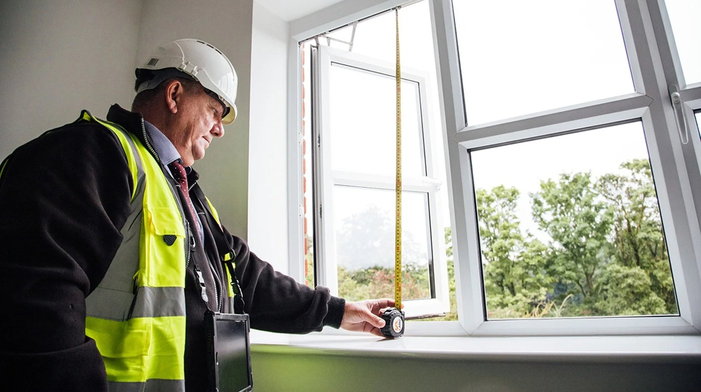 LABC Warranty surveyor inspecting interior windows