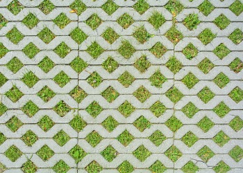 geometric-background-of-eco-floor-bricks-and-green-grass-eco-parking-picture-id1160066997