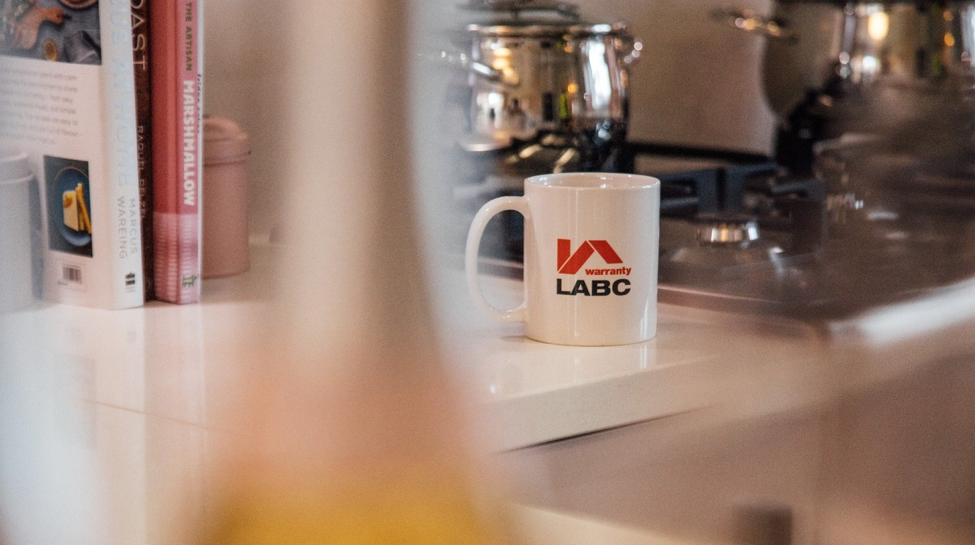 Lifestyle image of LABC Warranty mug in kitchen