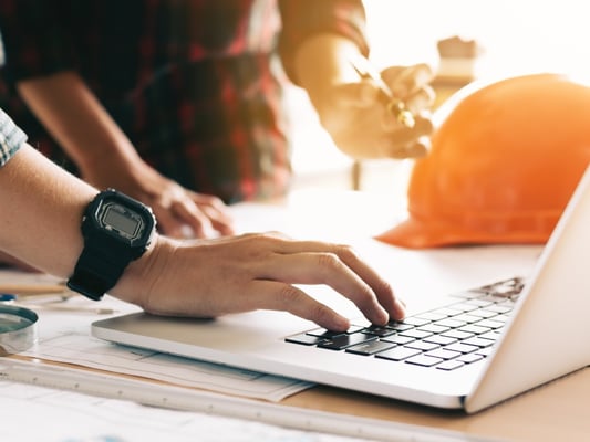 two-architects-coworker-working-together-on-project-and-using-laptop-picture-id873418996