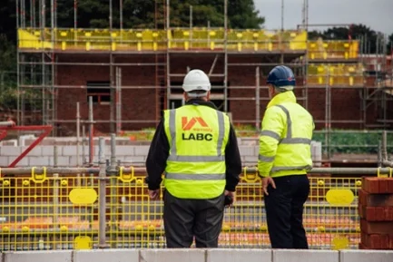LABC Warranty risk management surveyor talking to new home site manager